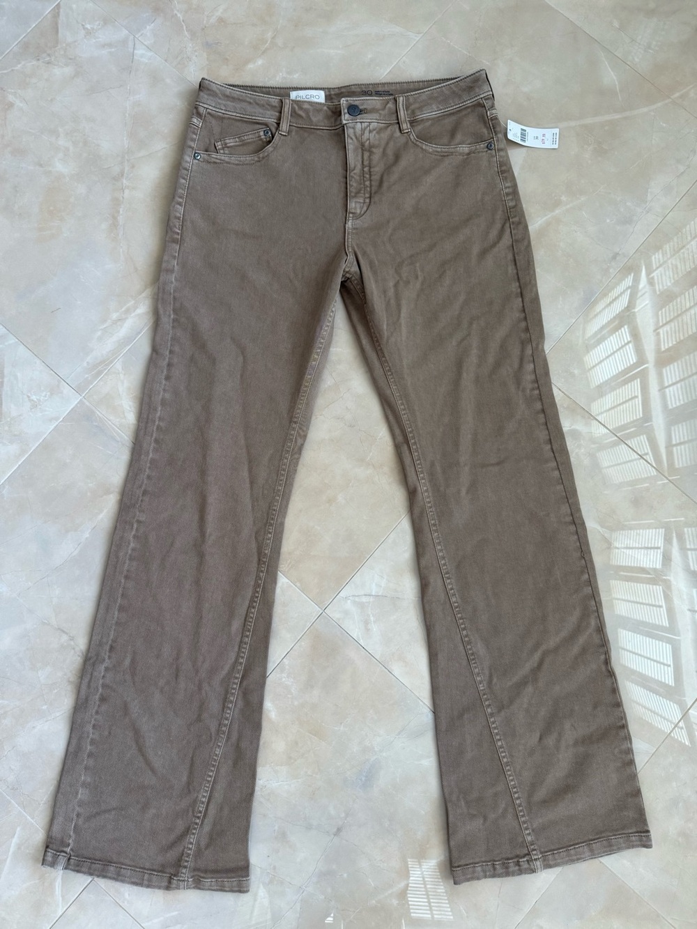 Pilcro tan mid-rise flare jeans